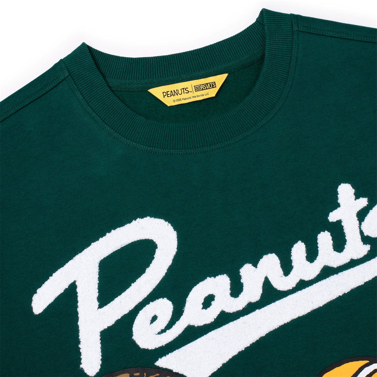 Close-up of the embroidered Woodstock graphic on the back of the sweatshirt