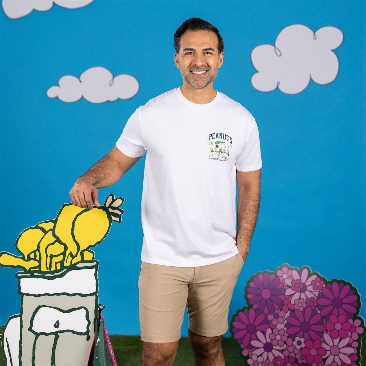 Back of the t-shirt showing Snoopy cheering on the golf course with bold graphic artwork