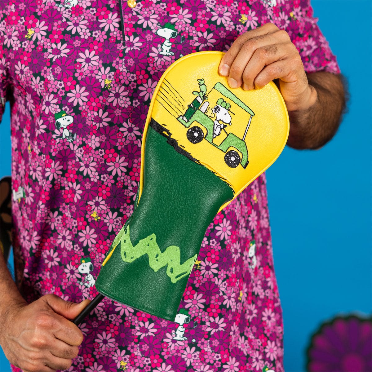 Side view of the Peanuts Country Club driver headcover showing detailed embroidery