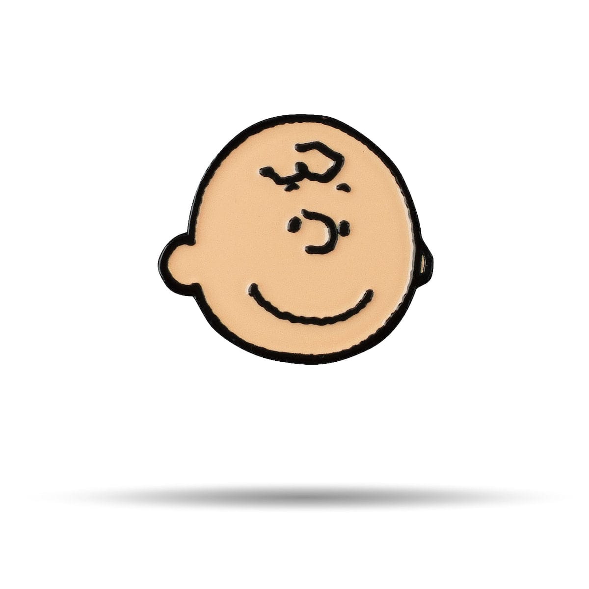 Metal golf ball marker featuring a full-color graphic of Charlie Brown against a patterned background