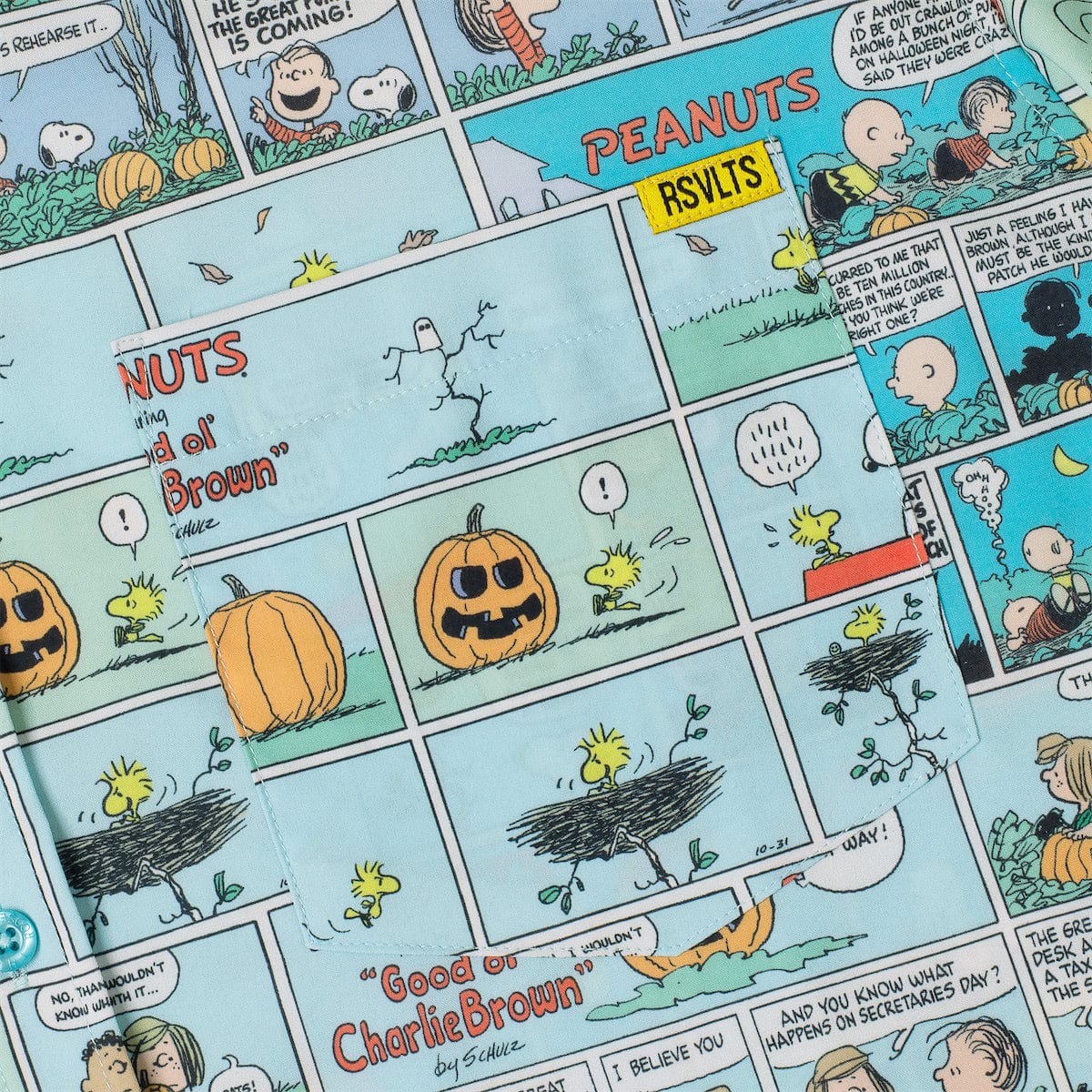Detail shot of the collar and button placket on the Peanuts Spooky Strips shirt